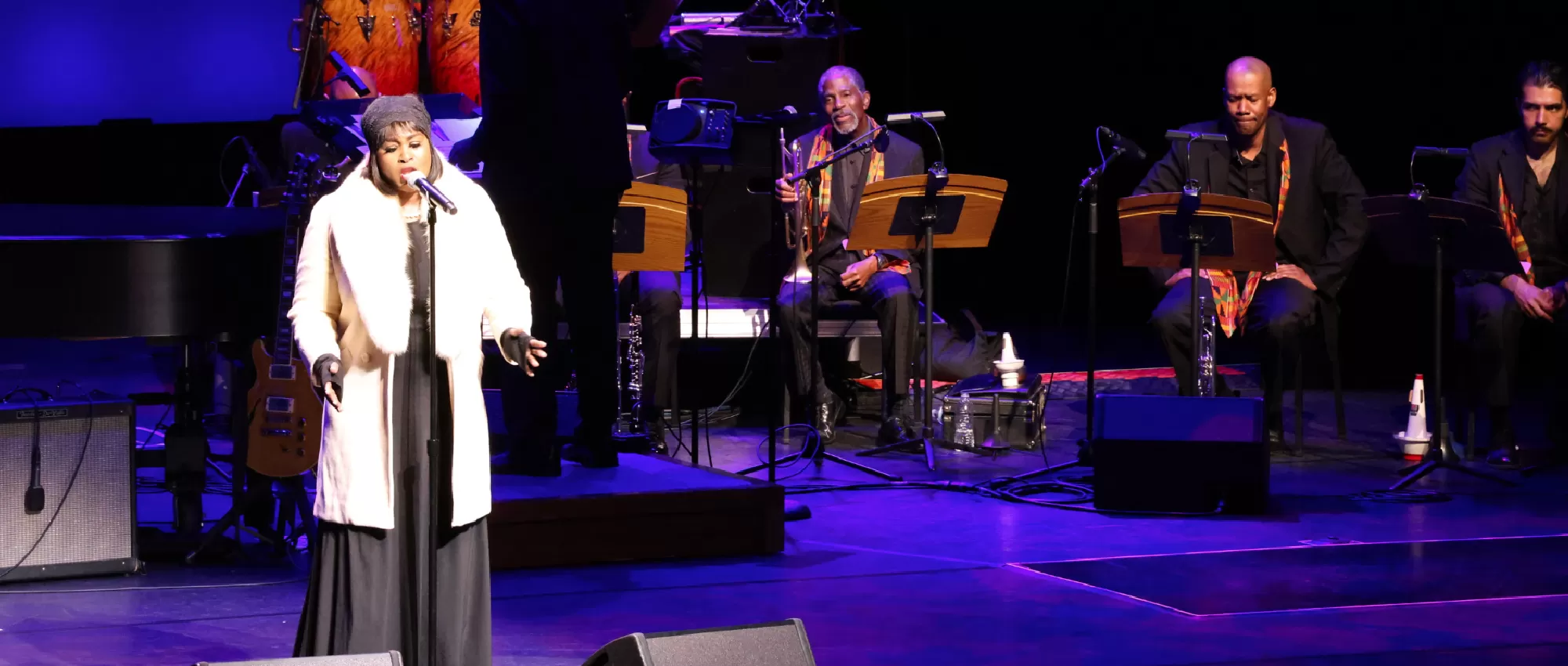 Martin Luther King, Jr. against a backdrop of musicial instruments