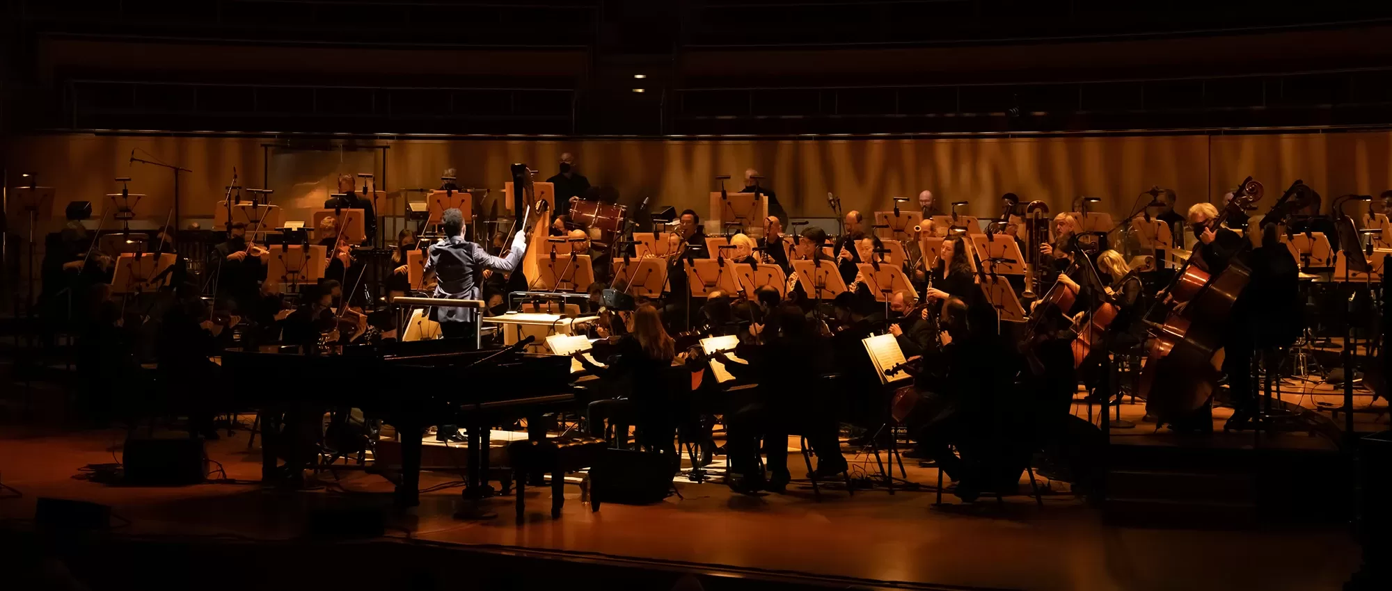 Ben Folds next to a piano